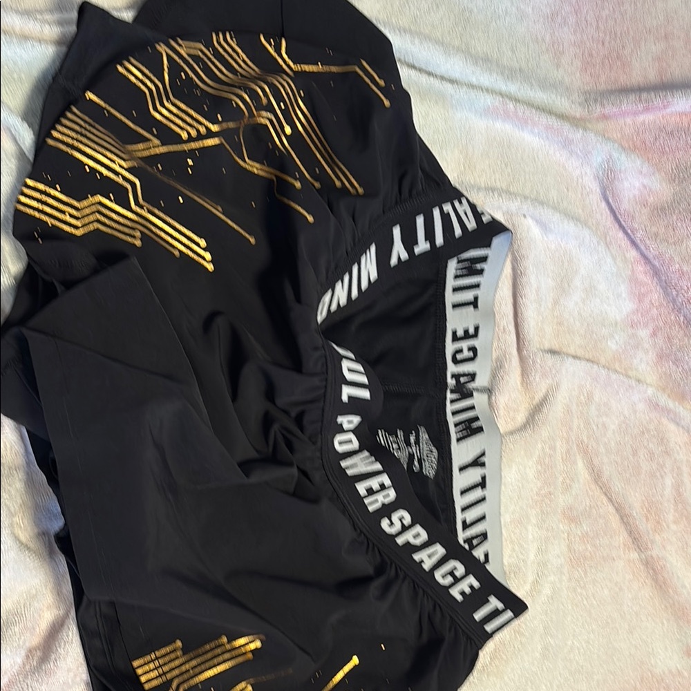 Her Universe Black and Gold Athletic Shorts
